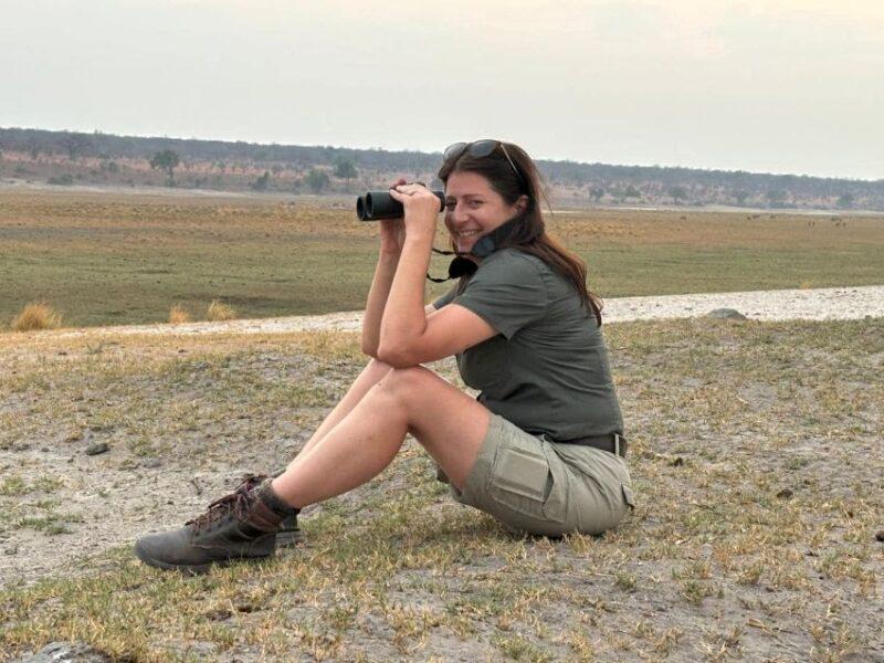 Female hunter glassing for hippos in the Caprivi