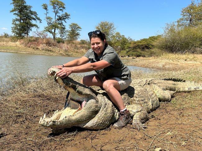 Lady posing with crocodile