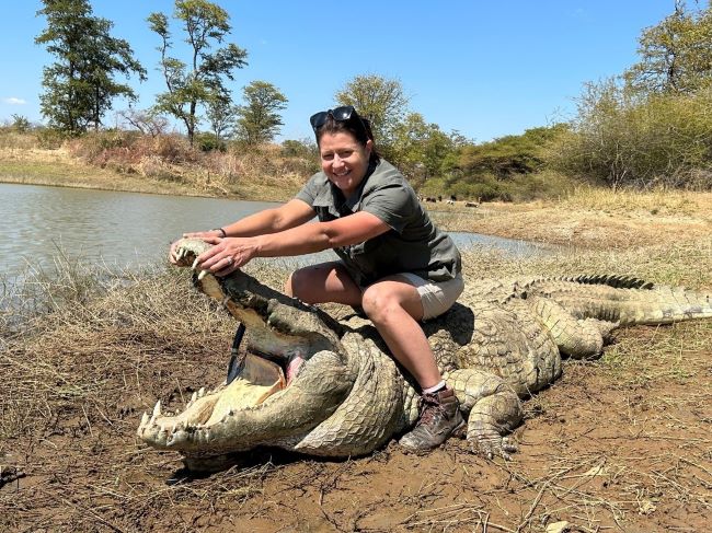 Lady posing with crocodile